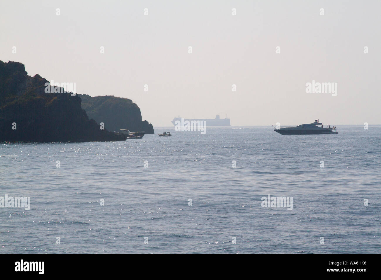 Small medium and large boats anchored off the coast of Sorrento, Amalfi Coast, Italy, Europe, with copy space Stock Photo