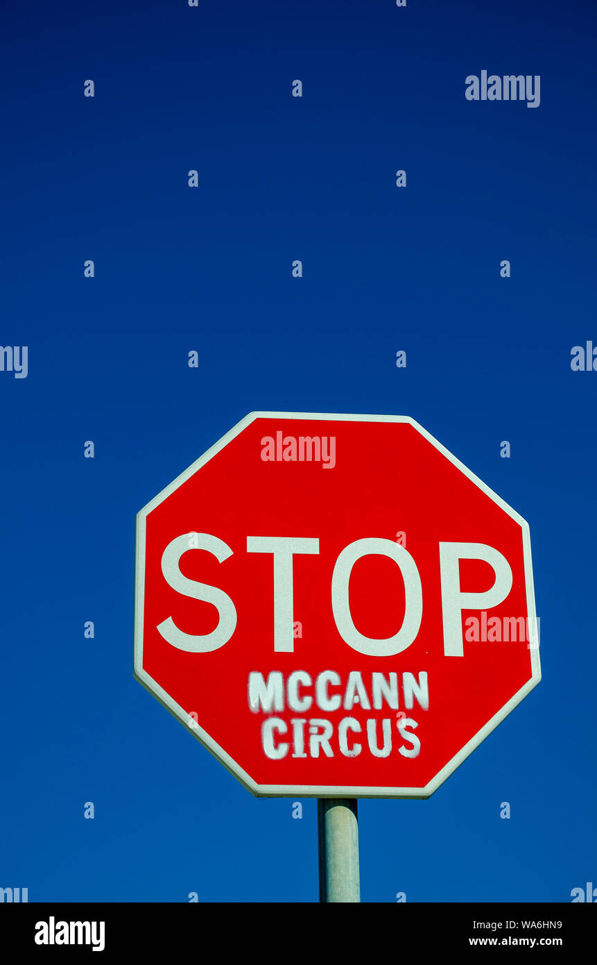 PRAIA DA LUZ, LAGOS /PORTUGAL - AUGUST 18 2019:  Graffiti on Stop sign asking to stop Madeleine McCann circus Stock Photo