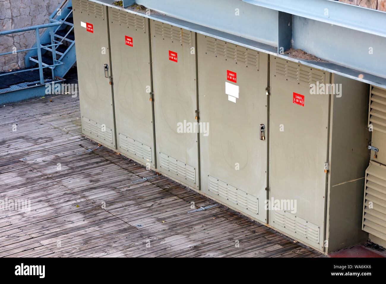Electricity power transformer substation boxes aligned in an outdoor facility Stock Photo