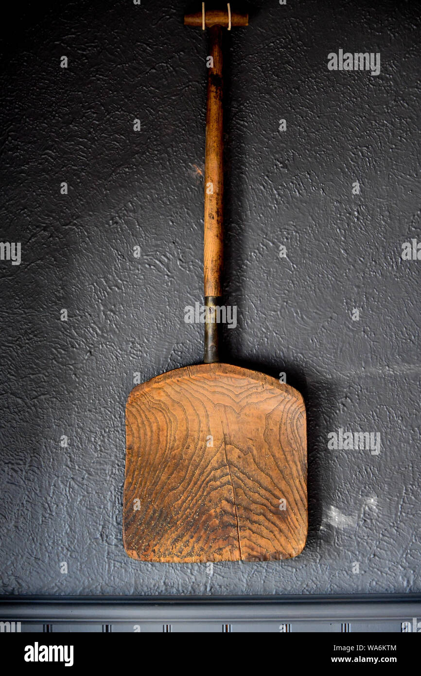 Wooden Shovel mounted on wall in Clarendon Arms Hotel, Evendale Tasmania, Australia Stock Photo