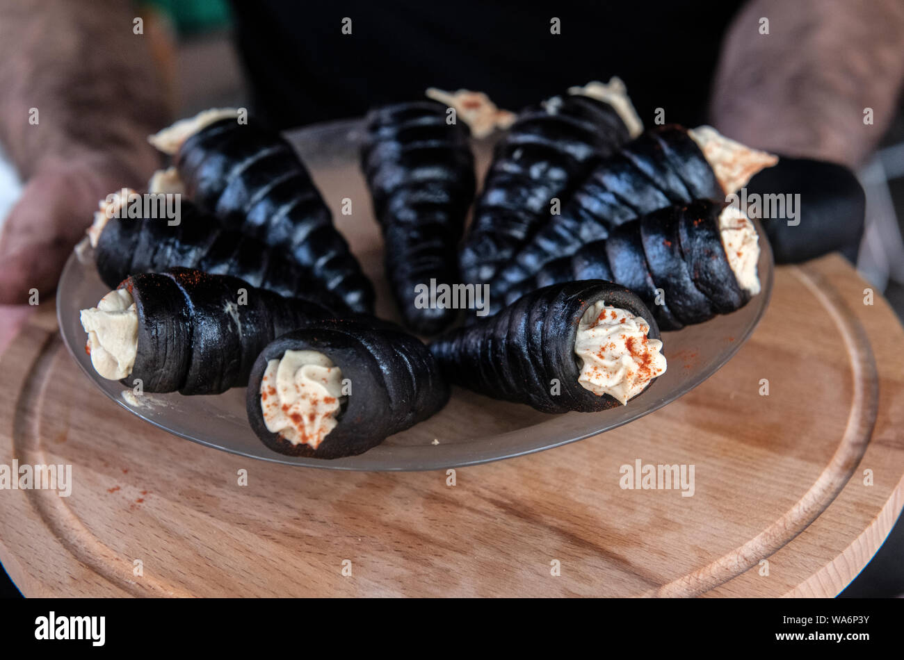 Berlin Germany 18 August 19 Hummus Cone From Syria Offers A Stand Operator At The Black Food Festival At The Festival On Sunday In Berlin Several Restaurateurs Joined Forces In A Beer