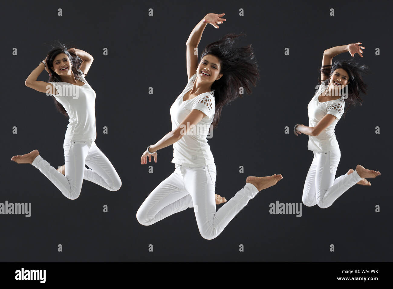 Multiple images of a young woman jumping in air and smiling Stock Photo ...