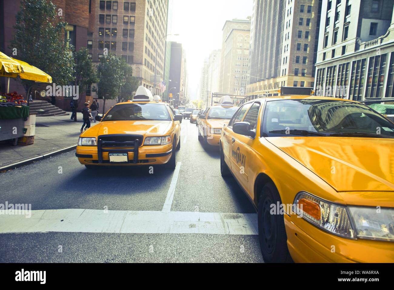 Shot of yellow taxi cabs on the street Stock Photo - Alamy