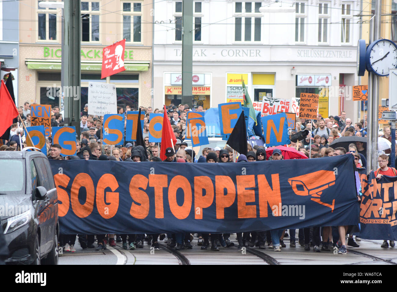 Rostock, Germany. 18 August 2019. Participants of a demonstration protest with a banner with the inscription 'SOG STOPPEN' against the tightening of the security and order law in Mecklenburg-Western Pomerania. The alliance 'SOGenannte Sicherheit' had registered 250 participants. The route led from Doberaner Platz via the police station in Ulmenstraße to the city harbour. Photo: Frank Hormann/dpa Credit: dpa picture alliance/Alamy Live News Stock Photo