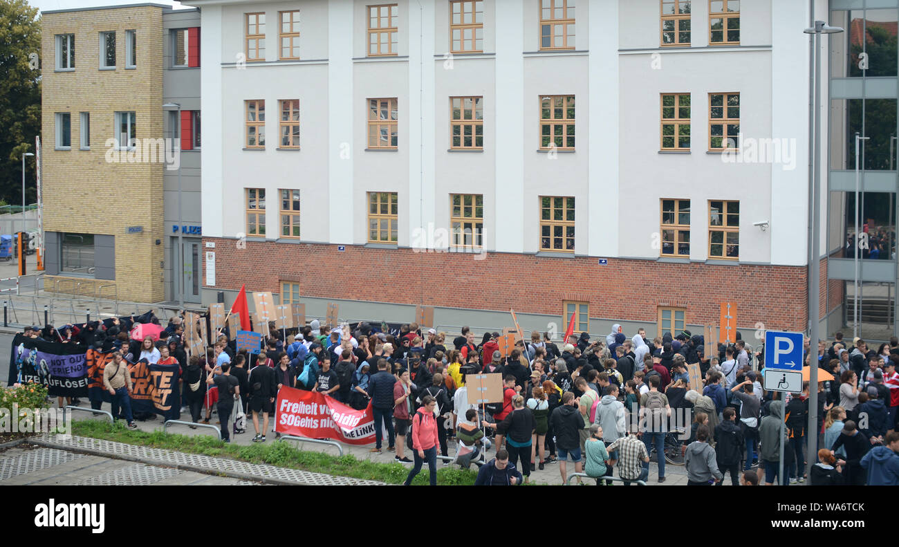 Rostock, Germany. 18 August 2019. Participants of a demonstration protest in front of the police station against the tightening of the security and order law in Mecklenburg-Western Pomerania. The alliance 'SOGenannte Sicherheit' had registered 250 participants. The route led from Doberaner Platz via the police station in Ulmenstraße to the city harbour. Photo: Frank Hormann/dpa Credit: dpa picture alliance/Alamy Live News Stock Photo