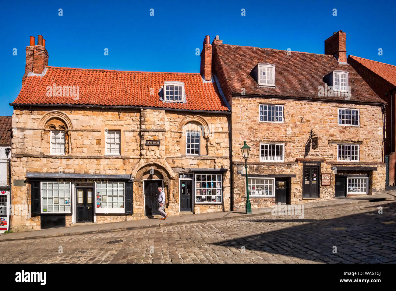 2 July 2019: Lincoln, Lincolnshire, UK - Jew's House and Jews' Court on Steep Hill, Lincoln. These buildings contain stonework from the 12th century. Stock Photo