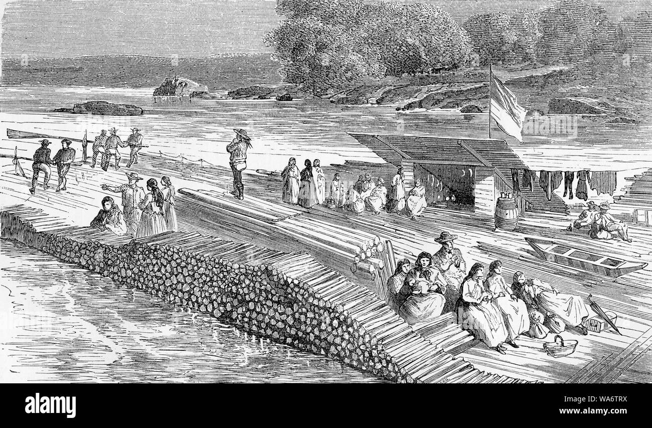 Timber rafting on the Donau river: families and people traveling with the wooden merchandise on the raft Stock Photo