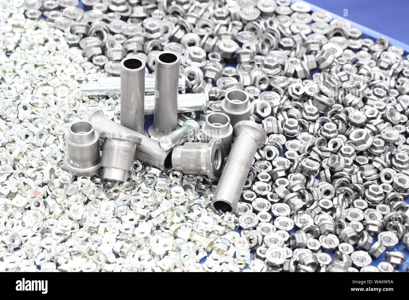 small bolts and nuts by manufacturing process ; tapping Stock Photo Alamy
