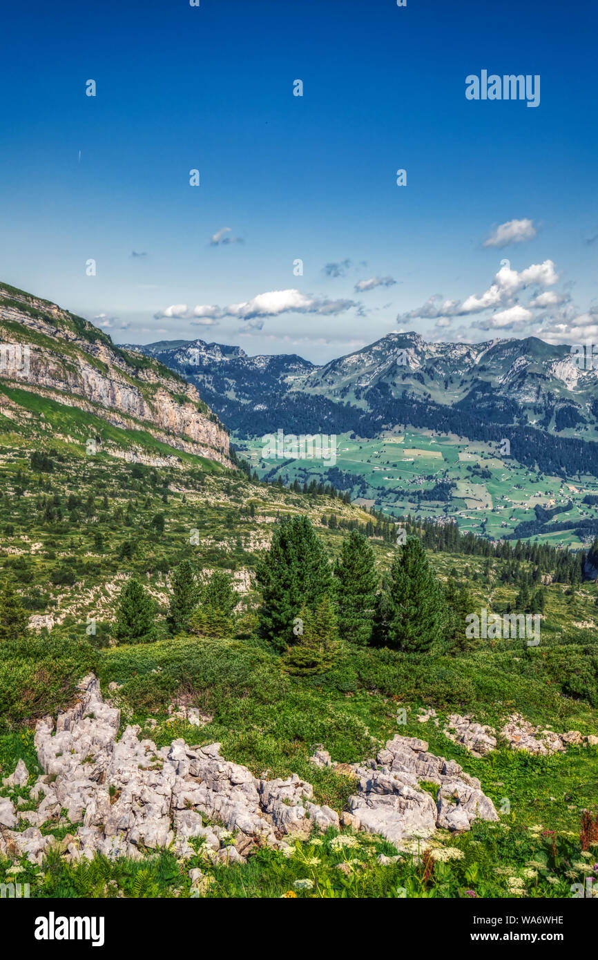 Hiking through swiss alps on a sunny day with blue sky near toggenburg ...