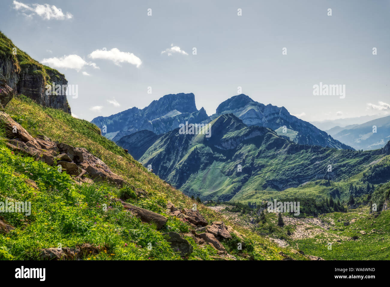 Hiking through swiss alps on a sunny day with blue sky near toggenburg ...