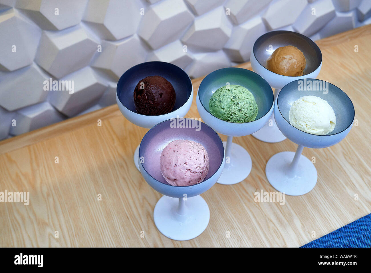 five types of ice cream of different colors in beautiful ice cream