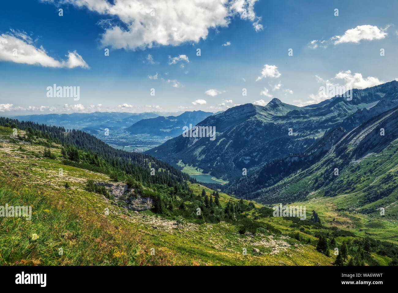 Hiking through swiss alps on a sunny day with blue sky near toggenburg ...