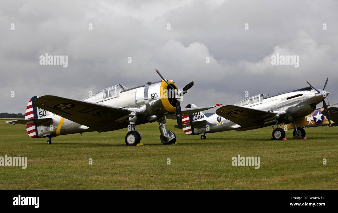 Curtiss-Wright P-36C (G-CIXJ) and Curtiss-Wright P.40C (G-CIIO) on the flightline at the Flying Legends Airshow on the 14th July 2019 Stock Photo