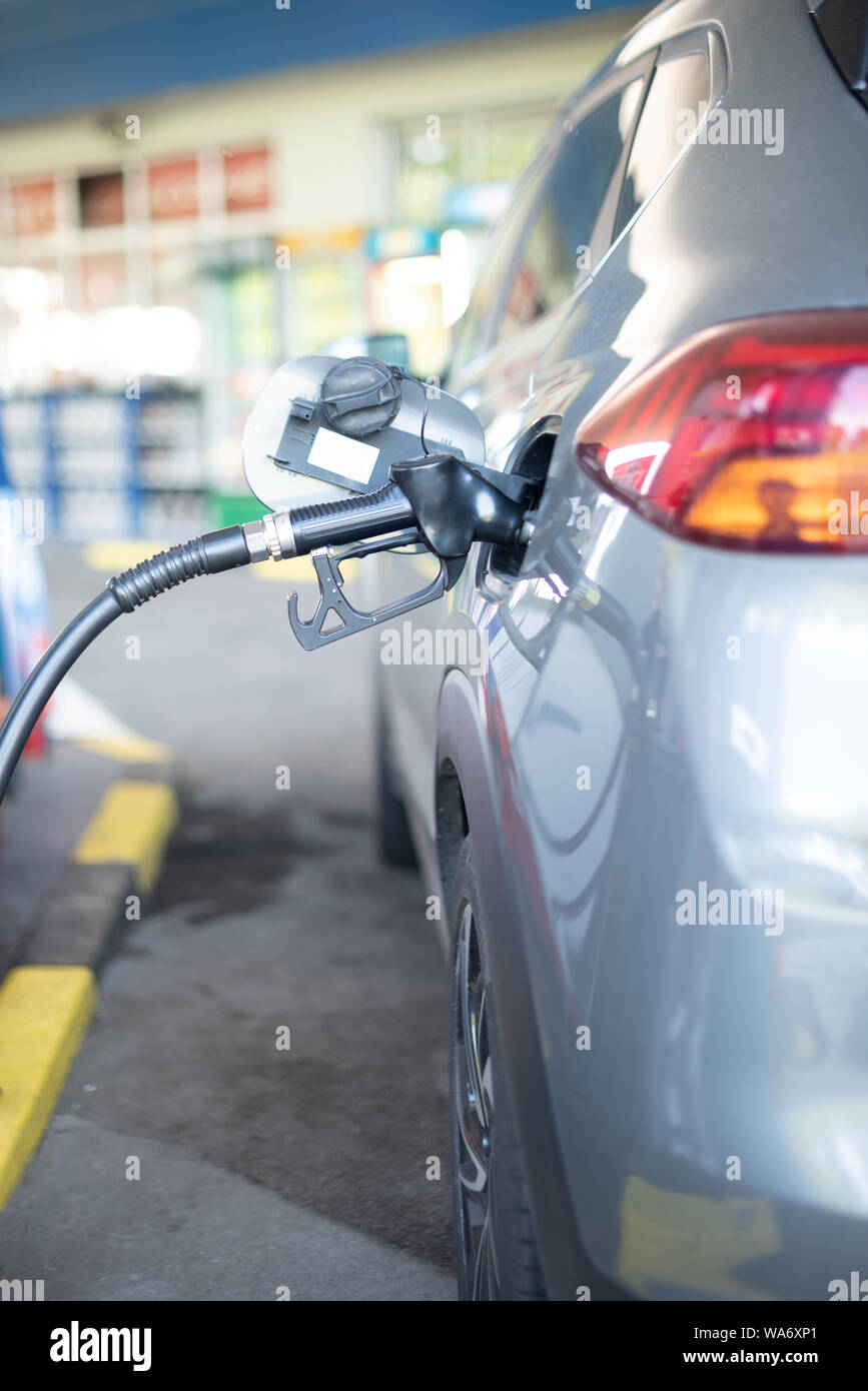 Refueling refilling car vehicle with fuel at refuel fuel gas pump