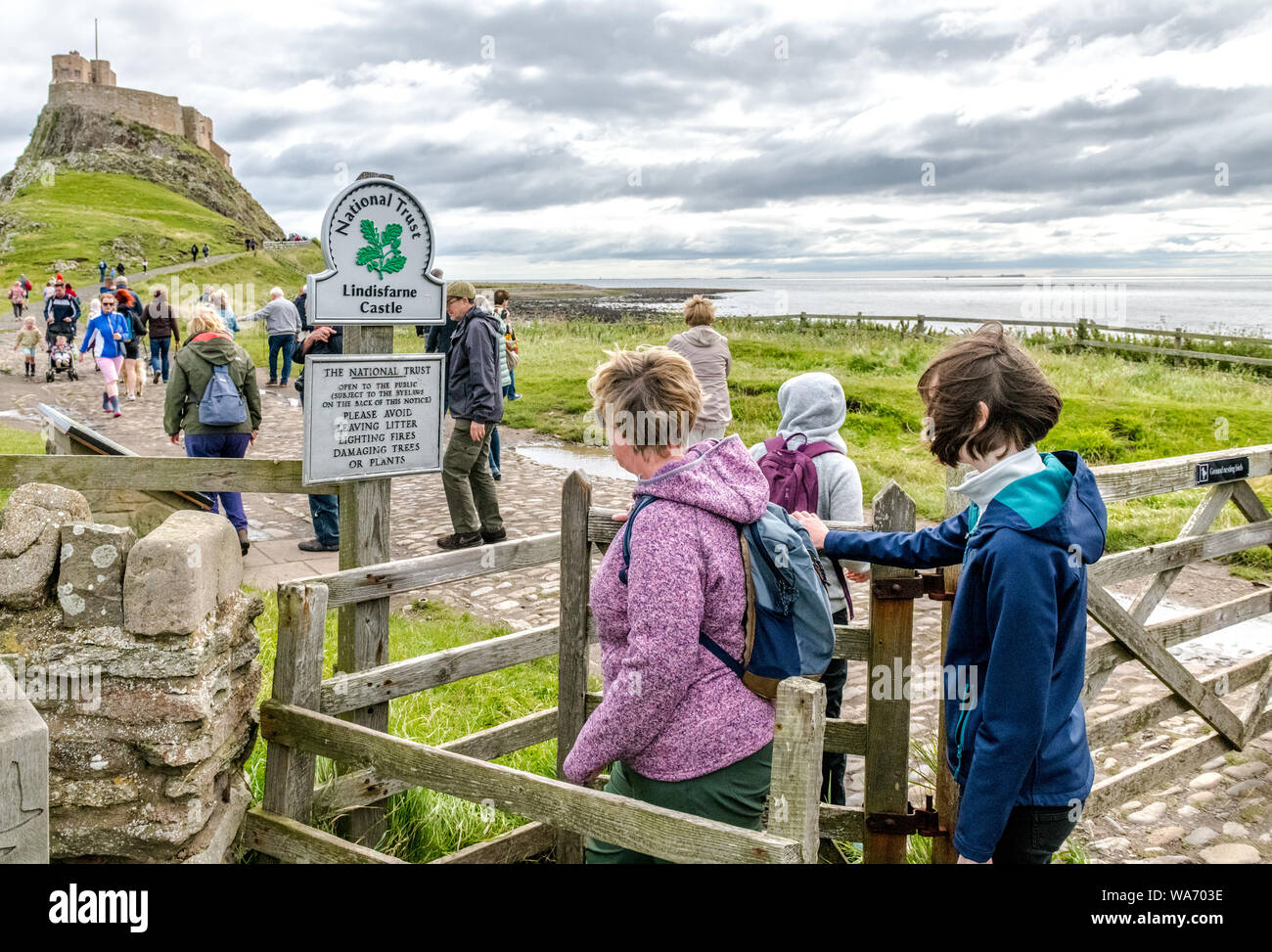 Visitors and tourists visit The Holy Island of Lindisfarne, Northumberland, England. Stock Photo