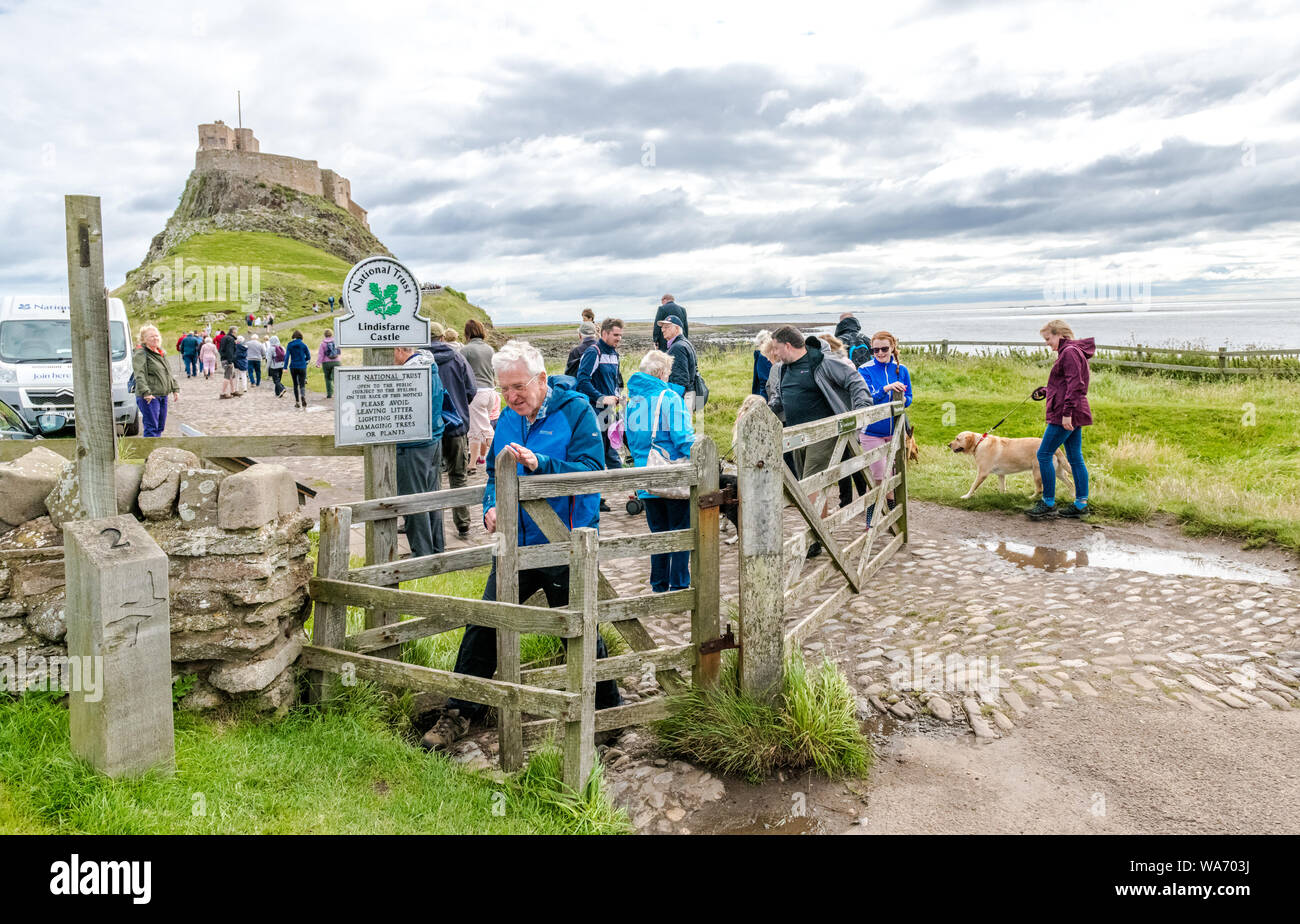 Visitors and tourists visit The Holy Island of Lindisfarne, Northumberland, England. Stock Photo