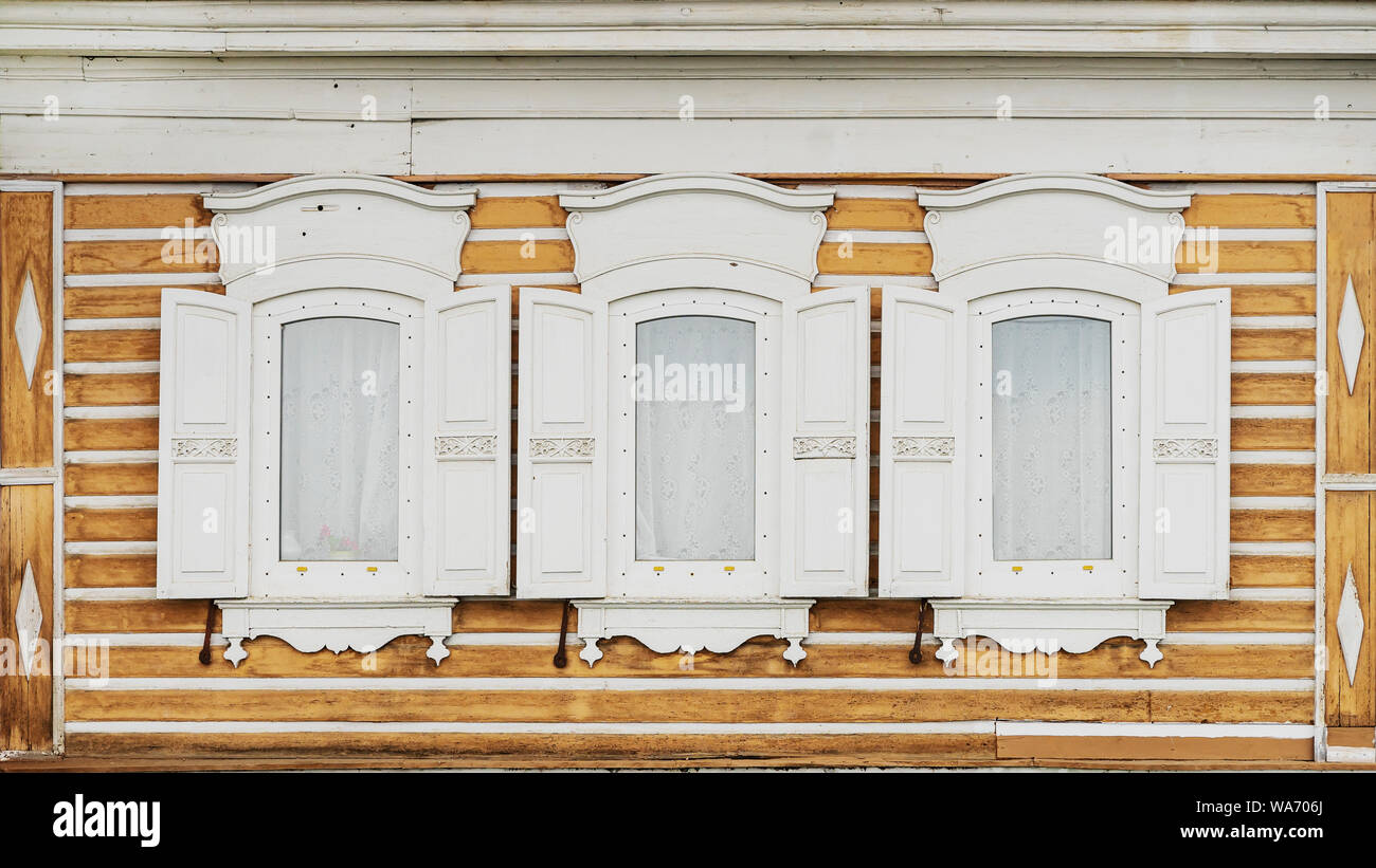 White wooden windows with shutters of an old village house Stock Photo ...