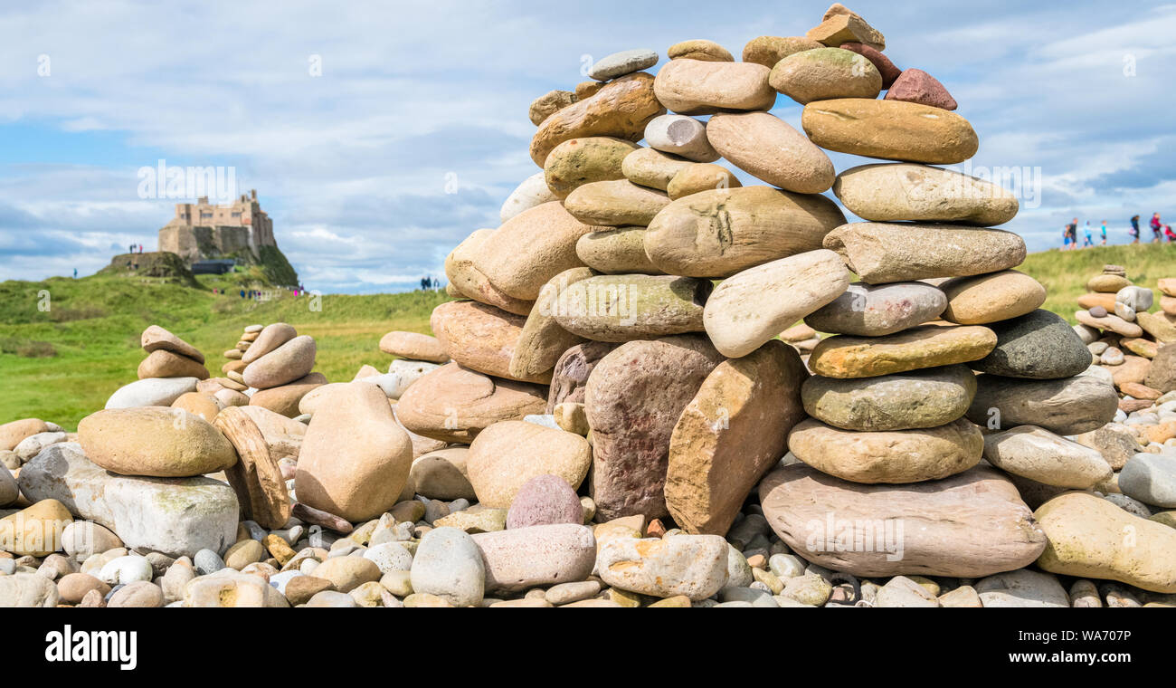 Stone art, fine balancing of stones on top of each other on The Holy Island of Lindisfarne, Northumberland, England. Stock Photo