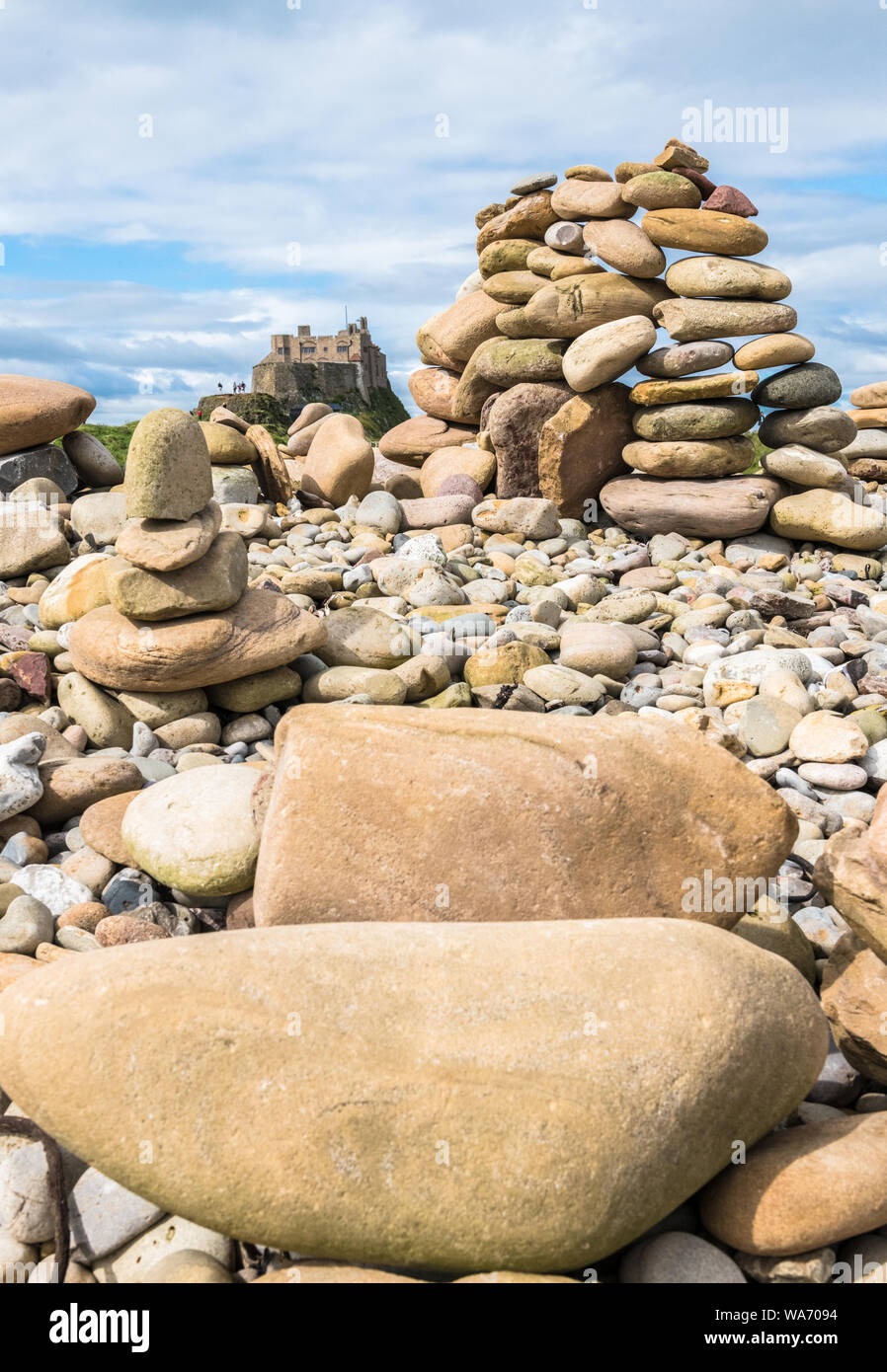 Stone art, fine balancing of stones on top of each other on The Holy Island of Lindisfarne, Northumberland, England. Stock Photo