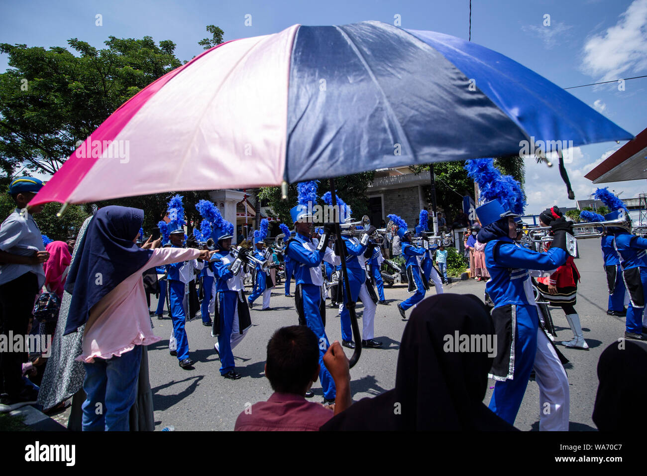 Lhokseumawe, Indonesia. 18 August 2019. Bands march during the 74th Independence Day carnival in Lhokseumawe. Credit: SOPA Images Limited/Alamy Live News Stock Photo