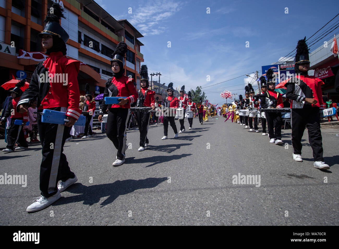 Lhokseumawe, Indonesia. 18 August 2019. Bands march during the 74th Independence Day carnival in Lhokseumawe. Credit: SOPA Images Limited/Alamy Live News Stock Photo