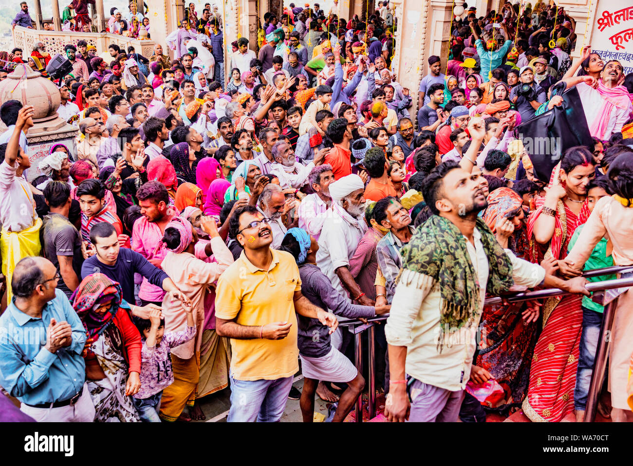 Barsana, India - February 23, 2018 - The crowd waits on the stairs for a temple to open during Holi festival Stock Photo