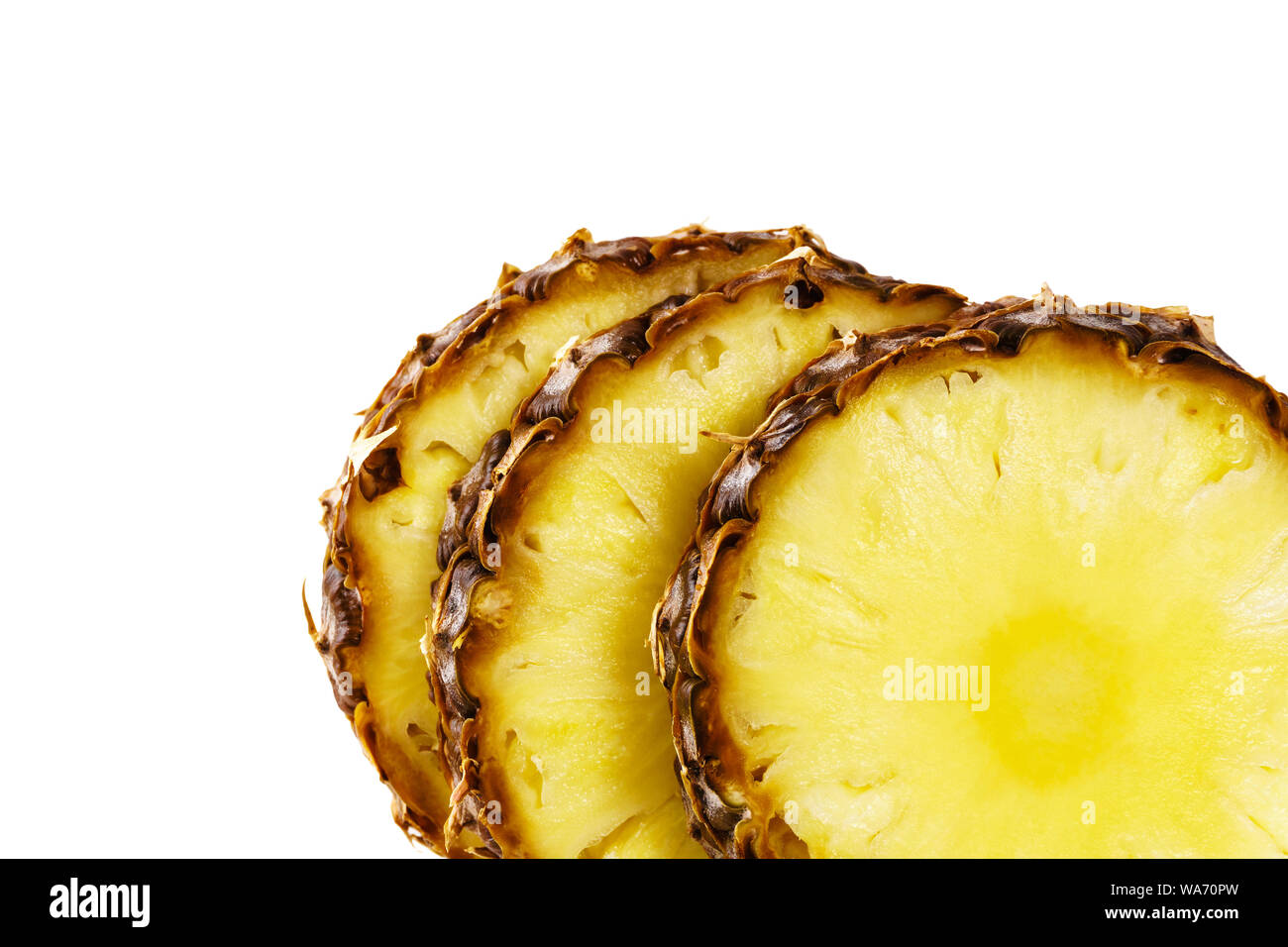 sliced ripe pineapple close up on white background Stock Photo
