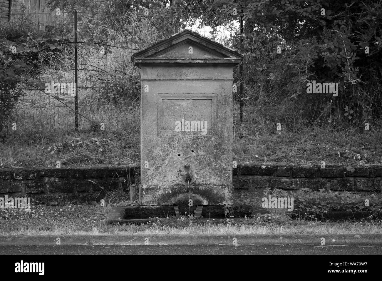 Old stone water fountain Stock Photo
