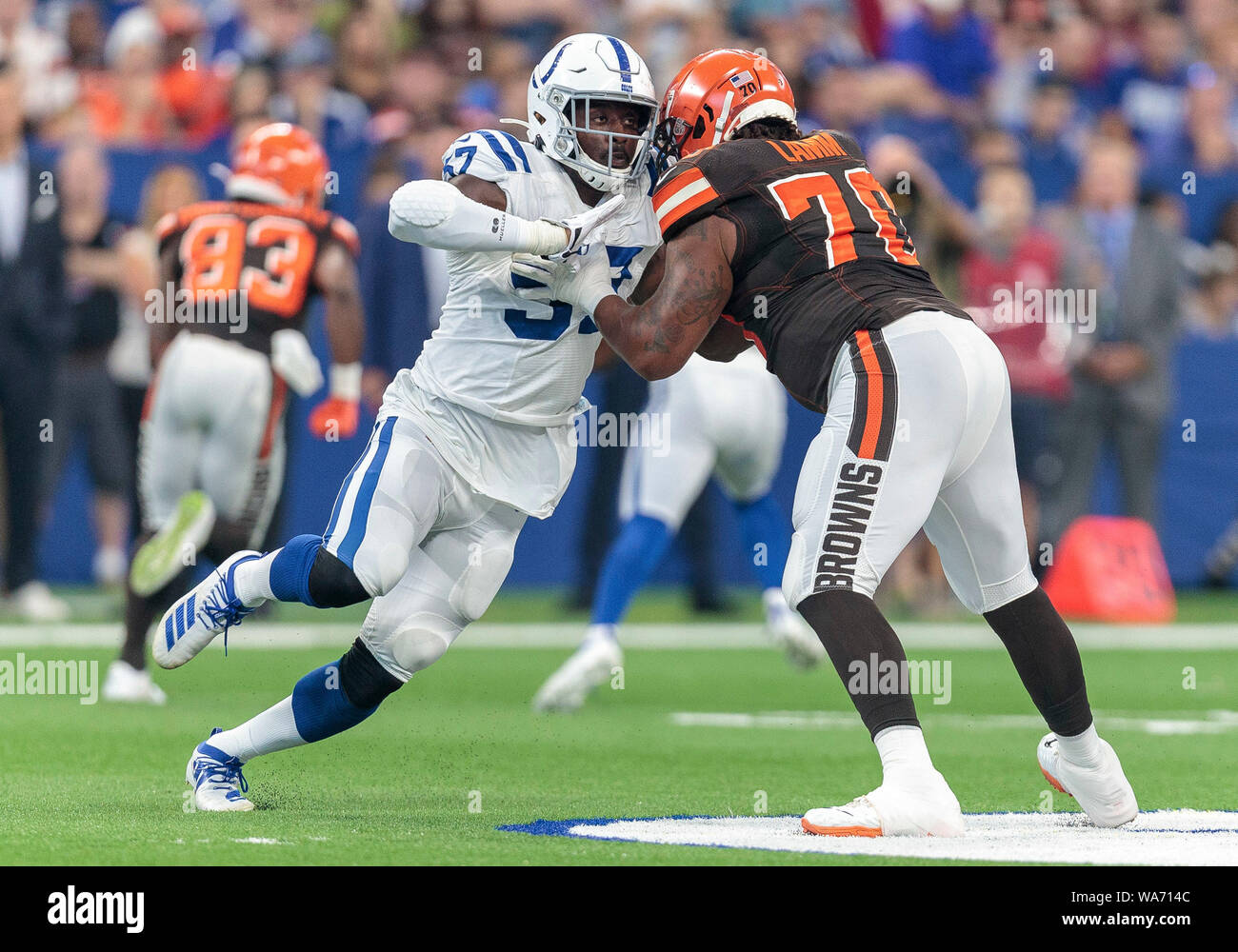 Indianapolis, USA. 17 August 2019.  Indianapolis Colts defensive lineman Kemoko Turay (57) and Cleveland Browns offensive lineman Kendall Lamm (70) battle at the line of scrimmage during NFL football preseason game action between the Cleveland Browns and the Indianapolis Colts at Lucas Oil Stadium in Indianapolis, Indiana. Cleveland defeated Indianapolis 21-18. John Mersits/CSM. Credit: Cal Sport Media/Alamy Live News Stock Photo