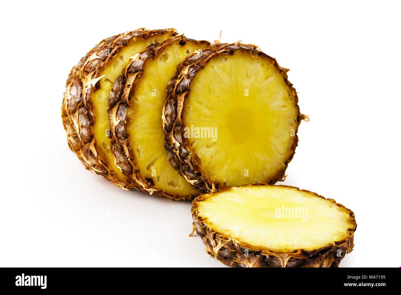 sliced ripe pineapple close up on white background Stock Photo