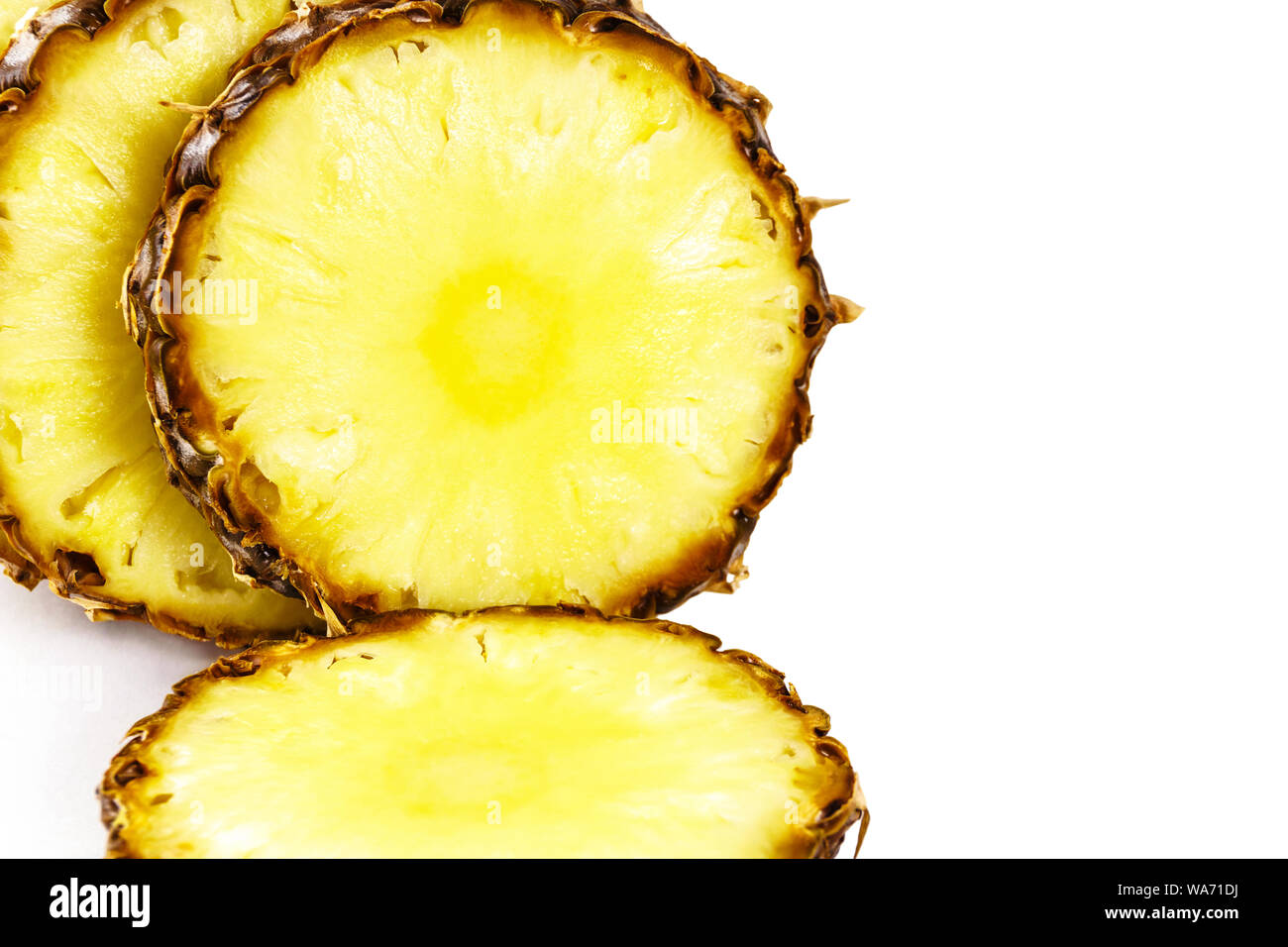 sliced ripe pineapple close up on white background Stock Photo