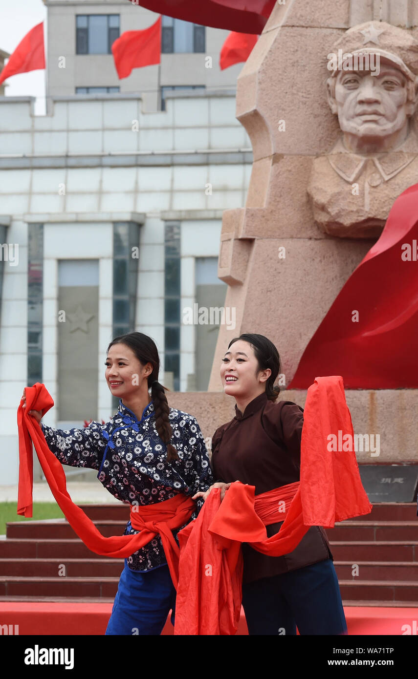 Huining, China. 18 August 2019. Artists perform during an event marking the conclusion of an activity that took journalists to retrace the route of the Long March, in Huining, northwest China's Gansu Province, Aug. 18, 2019. The activity, held from June 11 to Aug. 18, was aimed at paying tribute to the revolutionary martyrs and passing on the traditions of revolution.    The Long March was a military maneuver carried out by the Chinese Workers' and Peasants' Red Army from 1934 to 1936. During this period, they left their bases and marched through rivers, mountains and arid grass Credit: Xinhua Stock Photo