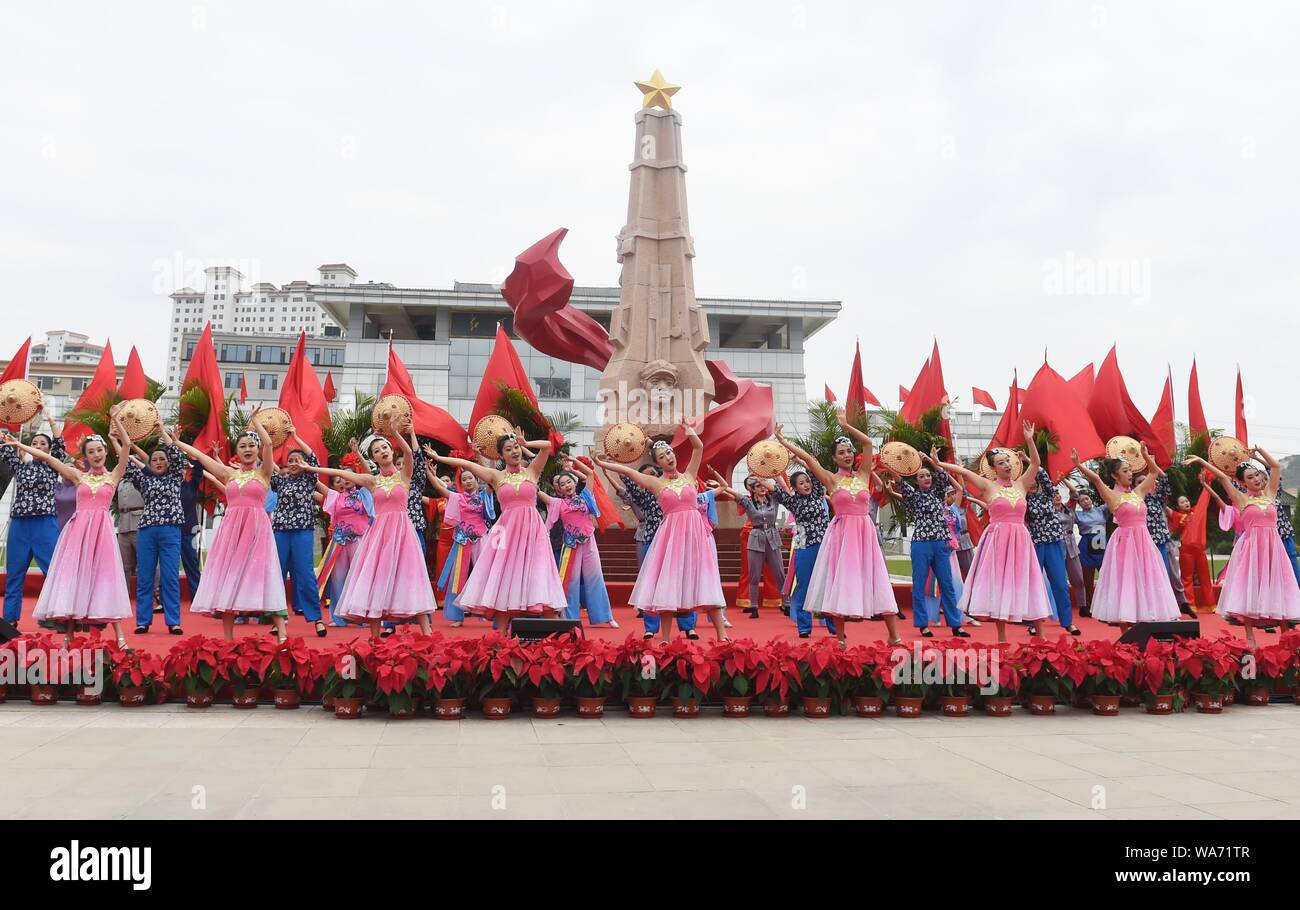 Huining, China. 18 August 2019. Artists perform during an event marking the conclusion of an activity that took journalists to retrace the route of the Long March, in Huining, northwest China's Gansu Province, Aug. 18, 2019. The activity, held from June 11 to Aug. 18, was aimed at paying tribute to the revolutionary martyrs and passing on the traditions of revolution.    The Long March was a military maneuver carried out by the Chinese Workers' and Peasants' Red Army from 1934 to 1936. During this period, they left their bases and marched through rivers, mountains and arid grass Credit: Xinhua Stock Photo