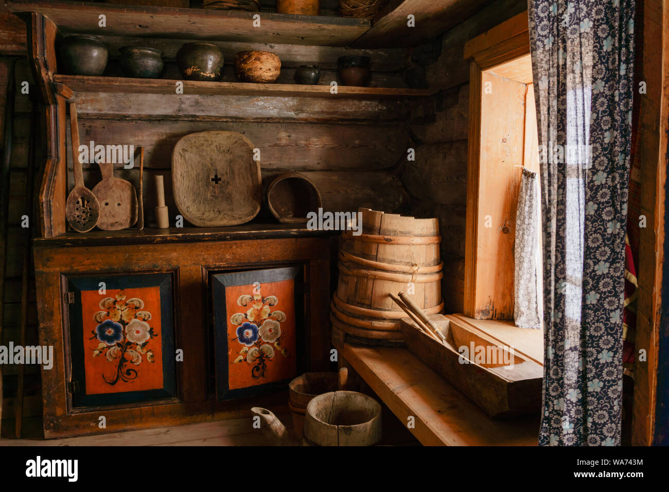 https://c8.alamy.com/comp/WA743M/fragment-of-the-interior-of-an-old-peasant-log-cabin-wooden-household-items-and-hand-painted-homemade-buffet-painting-created-in-the-19th-century-WA743M.jpg