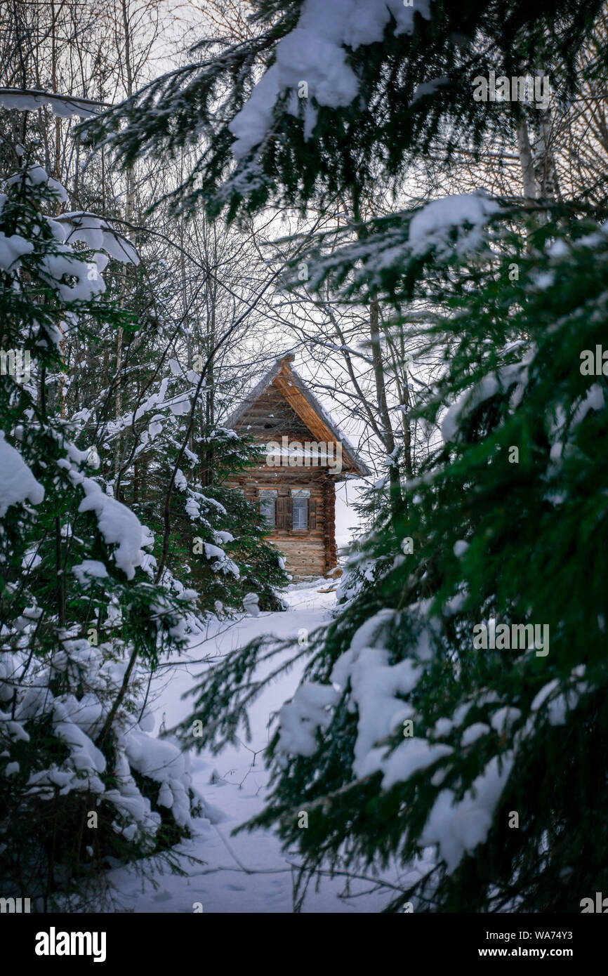 traditional vintage wooden house in the winter forest Stock Photo - Alamy