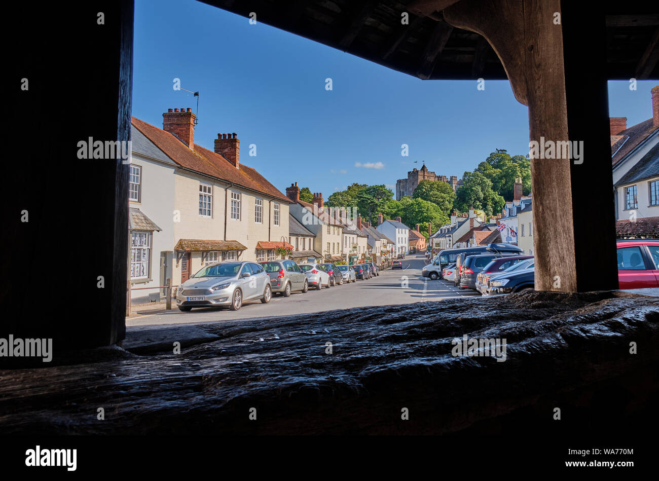 The view up Dunster High Street towards the Castle from the Yarn Market