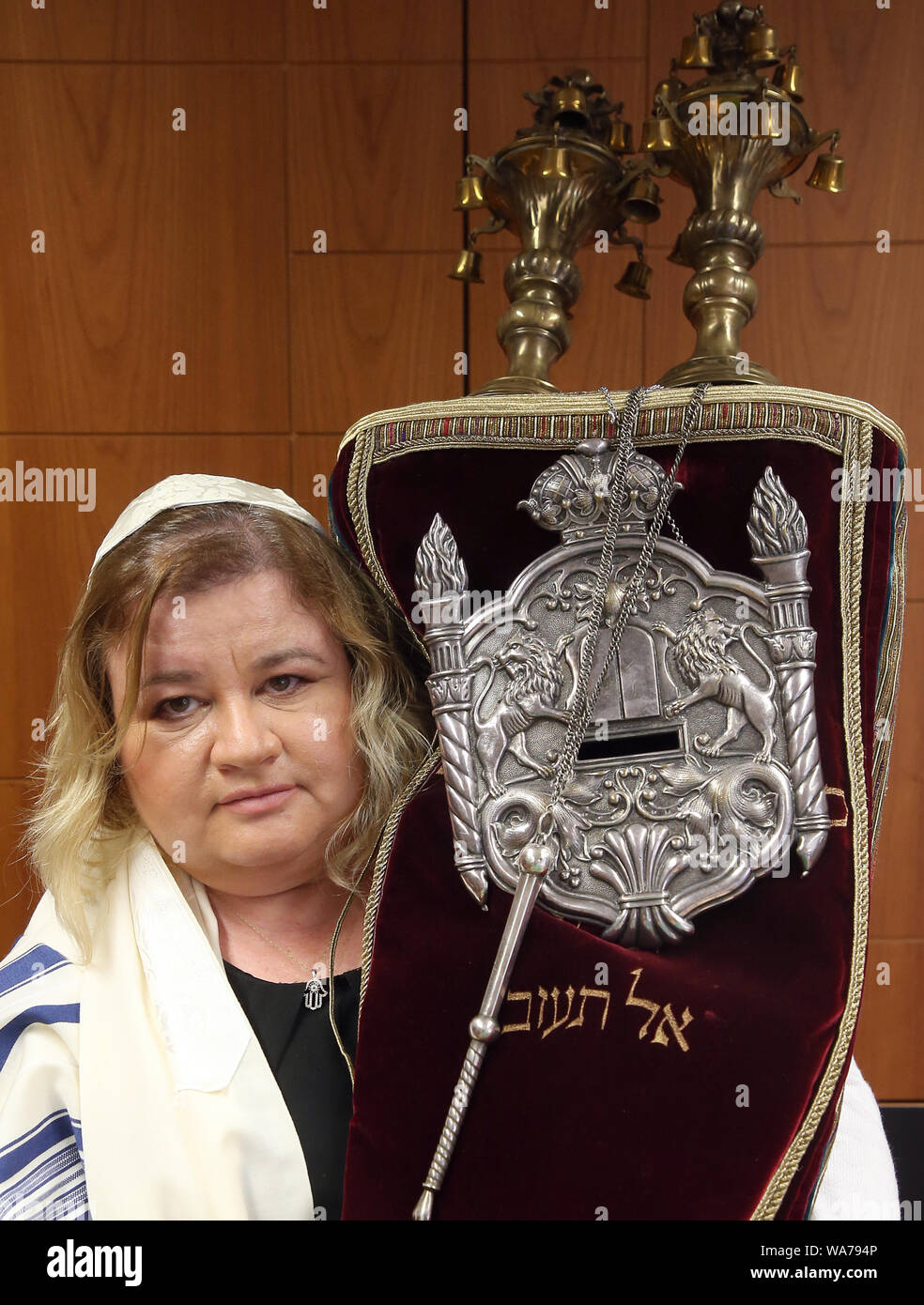 13 August 2019, Berlin: Anita Kantor holds a Torah scroll in her hands at  the Abraham Geiger College (AGK). As soon as she has finished her training  as a rabbi at the