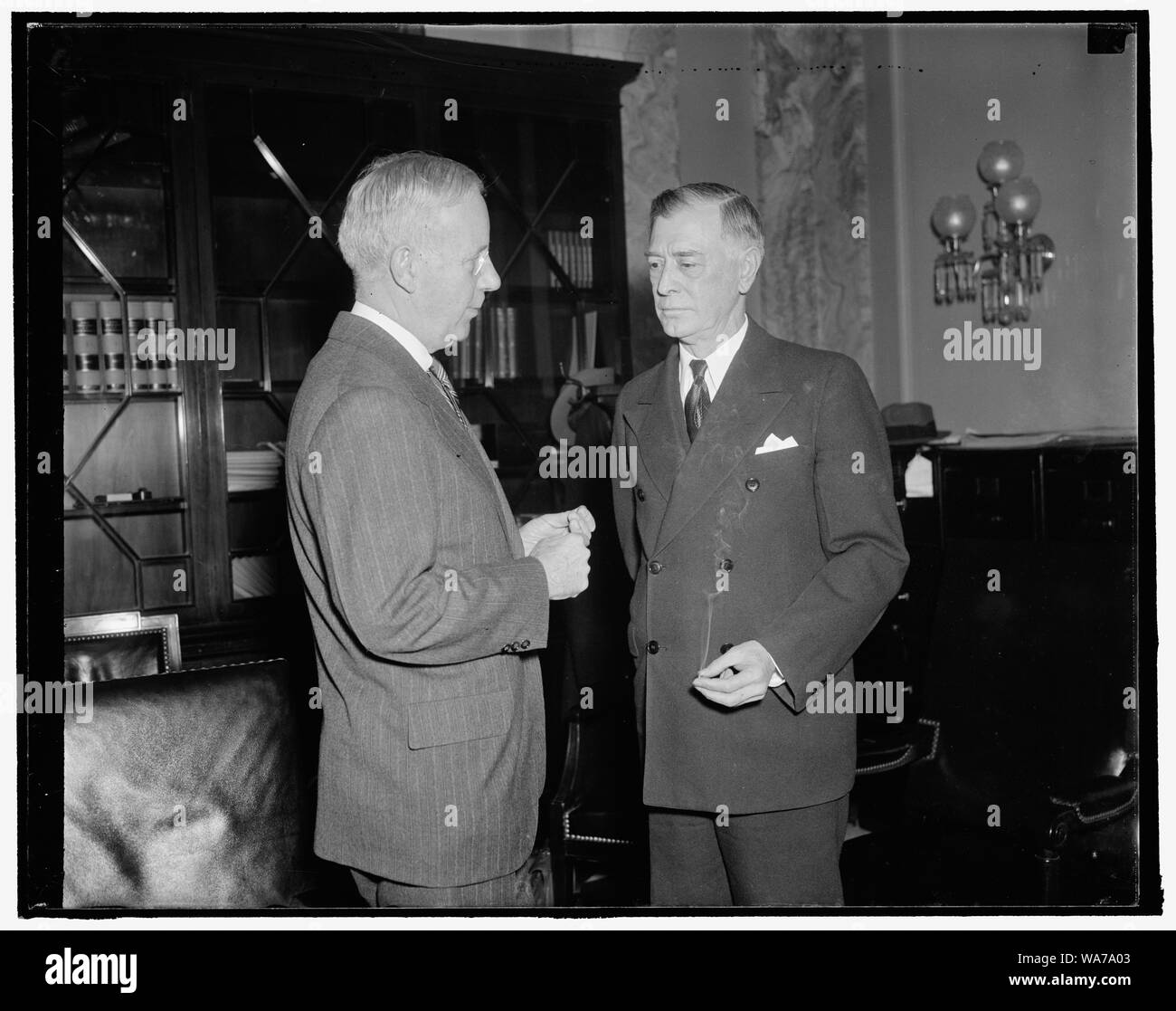 Admits Army finance office honored allegedly fraudulent CCC vouchers. Washington, D.C., Jan. 18. Major General Walter L. Reed, (left) Inspector General of the Army, today told Senator Key Pittman, Chairman of the Senate Public Lands Committee, the Army Chief Finance Offi[...] honor allegedly fraudulent CCC vouchers in go[...] faith. Reed made this declaration as he was [...] by the committee on the alleged defalcations o[...] Stitley, former Chief Voucher Clerk for the CCC [...] totaling $87,000, 1/18/38 Stock Photo