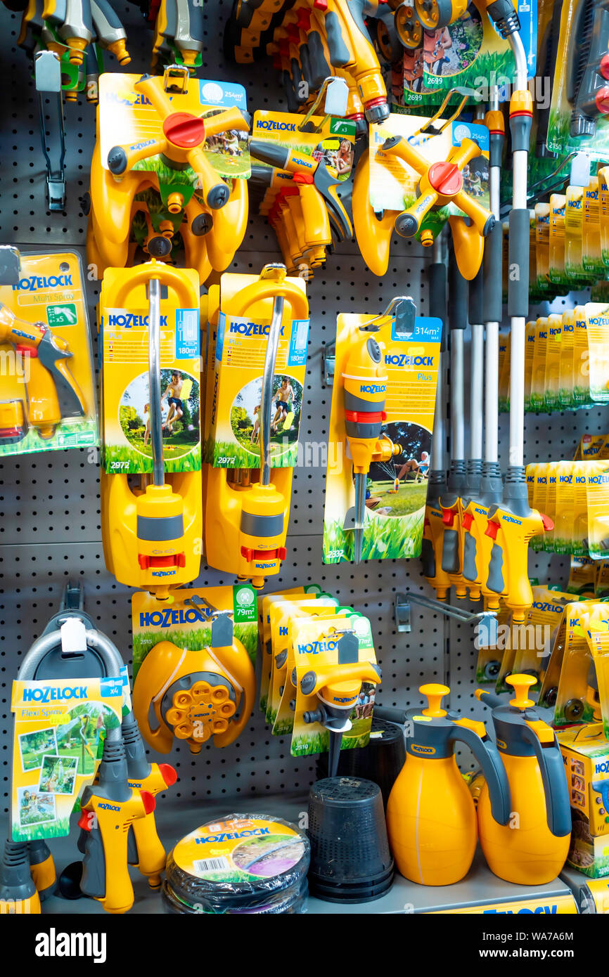 Display of Hozelok proprietary hose fittings on display in a garden centre Stock Photo