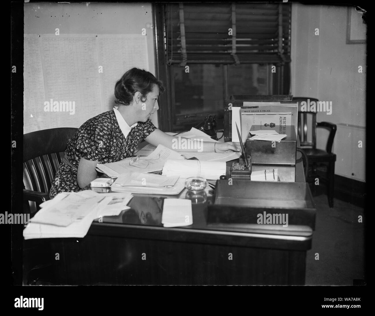 Aide to Rex Turwell, Washington, D.C. Sept. 29. An important figure in the resettlement is Miss Grace E. Falke, Executive Assistant to the Administrator Rex Tugwell. It was Miss Falke who had the final say on the interior furnishins for Greenbelt, the Resettlement Administration's planned city at Berwyn Heights, Md., which has just been completed Stock Photo
