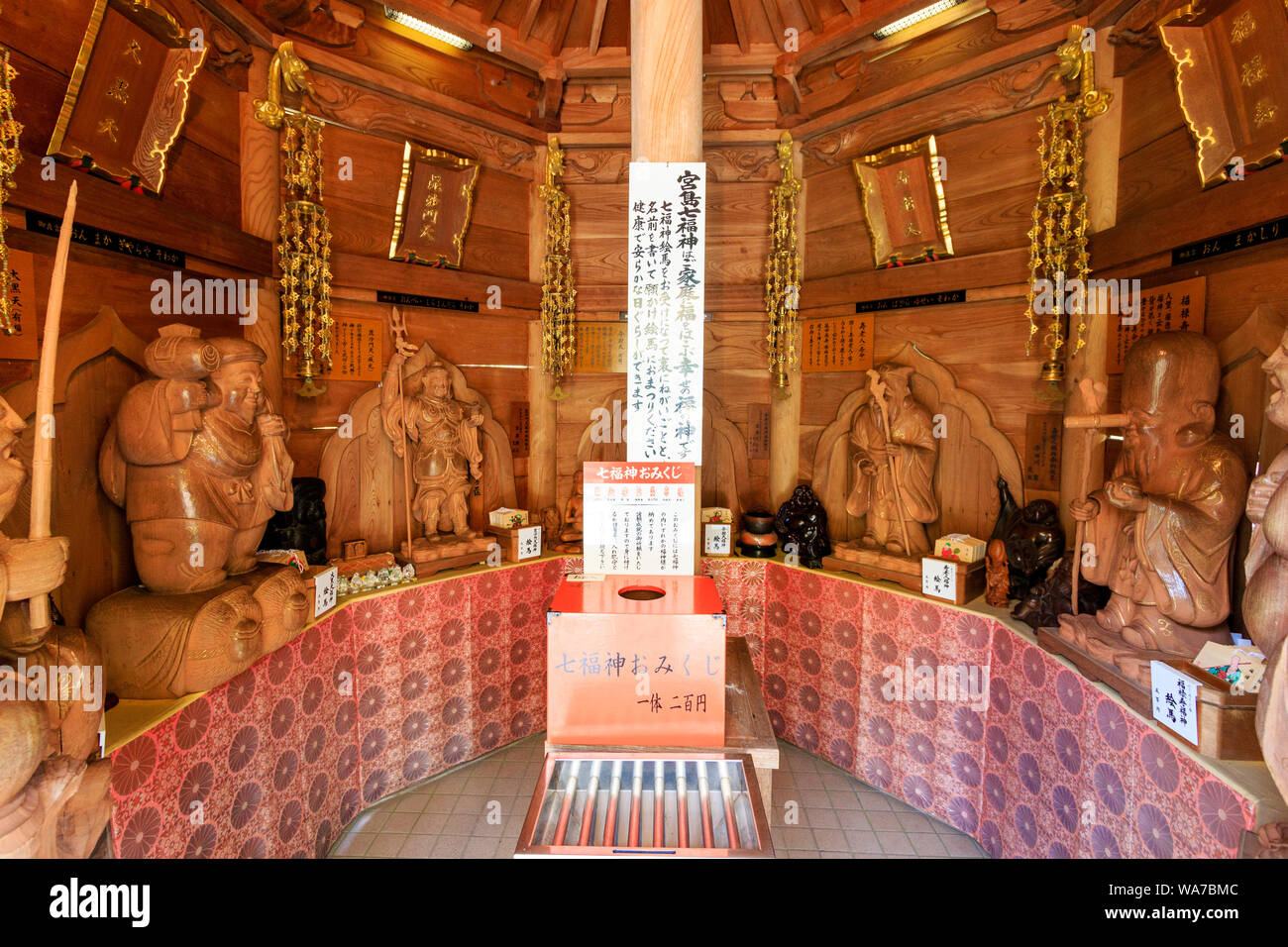 Japan, Miyajima. Daisho-in temple. Interior of the octagonal Hakkaku Manpuku-do Hall made of Japanese zelkova with the Seven Deities of Good Fortune. Stock Photo