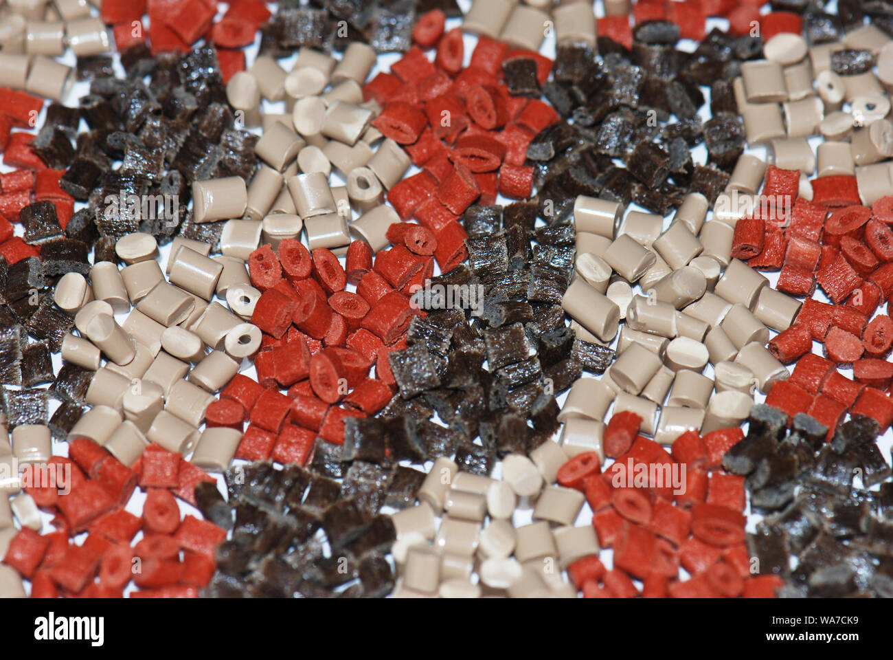 different brown polymer resins for injection molding Stock Photo