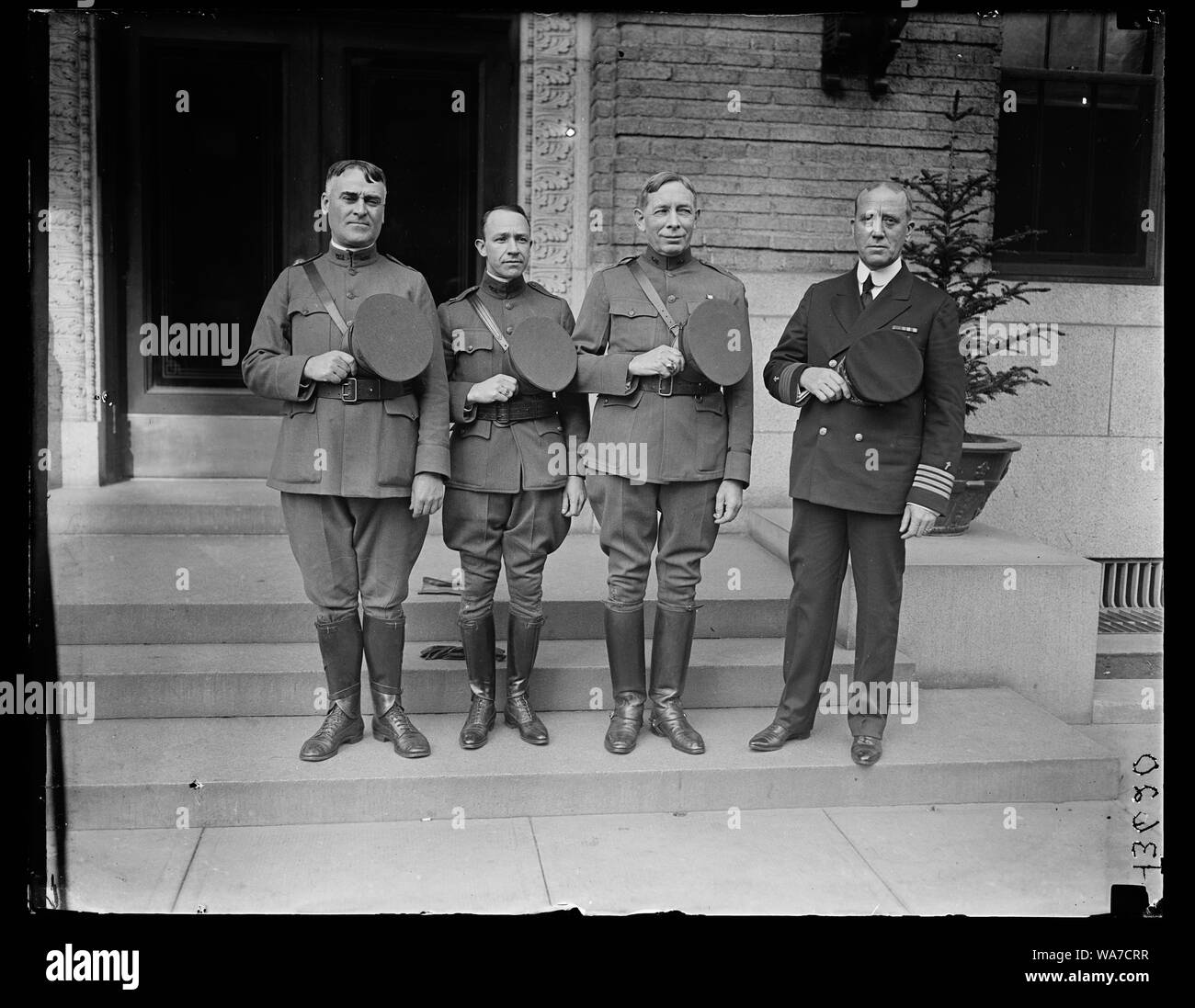 Army and Navy Chaplains who will officiate at the burial of An Unknown American Soldier at Arlington National Cemetery, November 11th, 1921. Left to right: Chaplain John T. Axton, D.S.M, Chief of Chaplains, U.S.A.; Dr. Norris S. Lazaron, Chaplain at Large, U.S.A. Right Rev. Charles H. Brent, D.S.M., Senior Chaplain American Expeditionary Forces; and Chaplain John B. Frazier, Supervisor Chaplains Corps, U.S.N. Stock Photo
