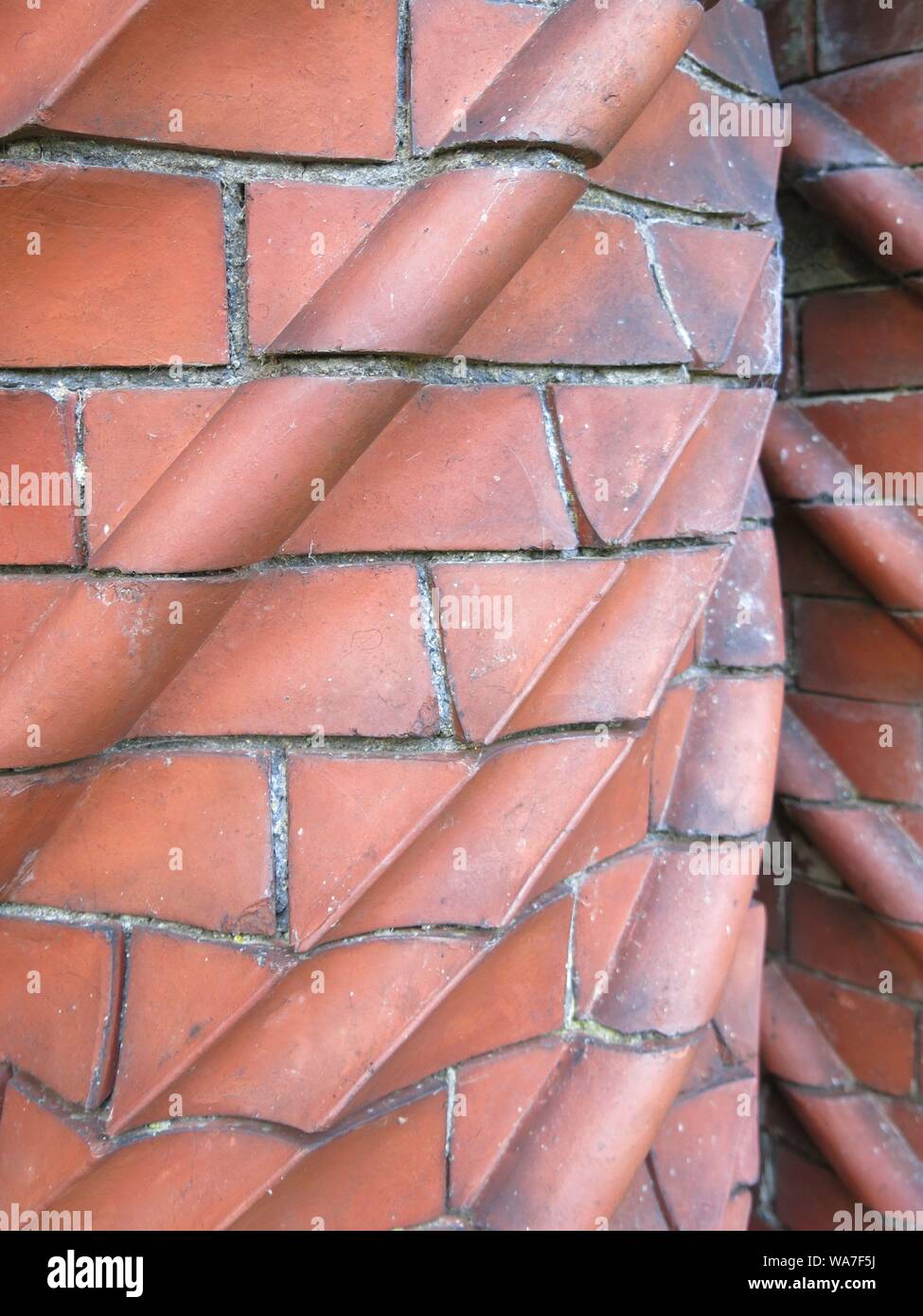 Close-up of the spiral pattern on an ornate, twisted, brick chimney-pot, originally from a cottage in Cardiff, Wales. Stock Photo