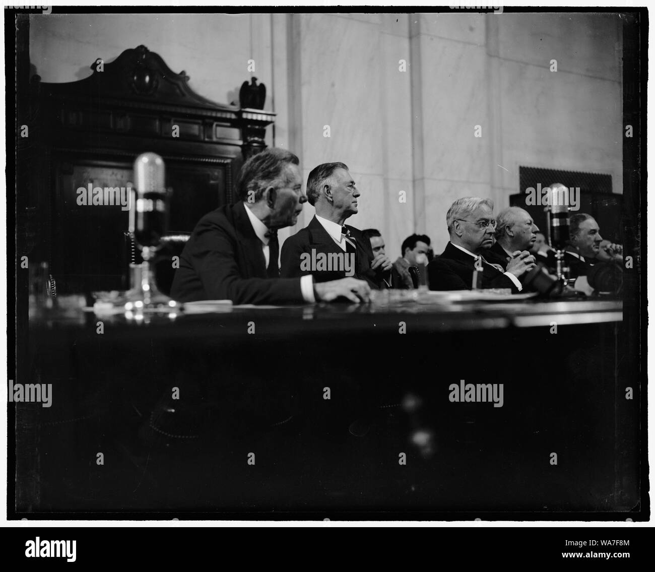 Attentative experts. Washington, D.C., April 6. All experts on foreign relations, these three Senators - William E. Borah, left, Key Pittman, and Hiram Johnson - listen attentively as Barnard Baruch testifies before Senate Foreign Relations Committee. Senator Pittman is present Chairman of the Committee. 4-6- 39 Stock Photo