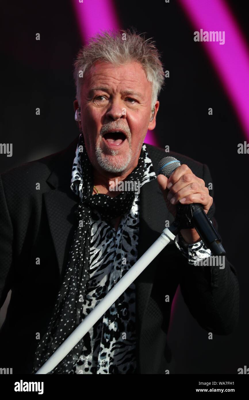 Henley-on-Thames, UK, 18th Aug 2019, Thousands of music fans gathered to enjoy a weekend of live 80’s music from their musical legends at the Rewind South festival. Sunday featured a star-studded line-up. Paul Young  entertained the audience with his music. Credit: Uwe Deffner / Alamy Live News Stock Photo