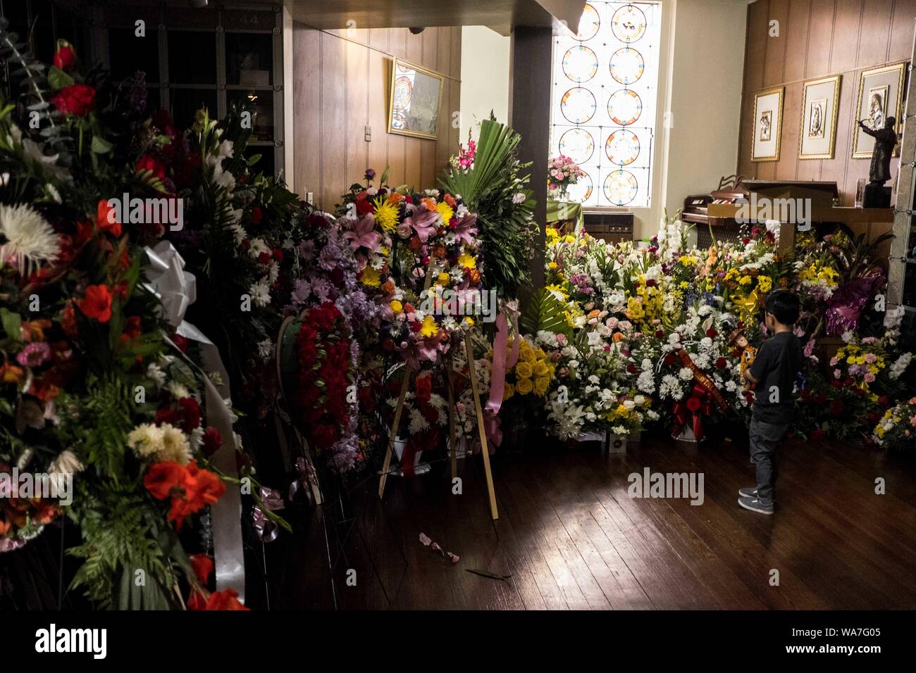 Ian Ben 5 Of El Paso Looks At A Display Of Flowers To Be Loaded Into
