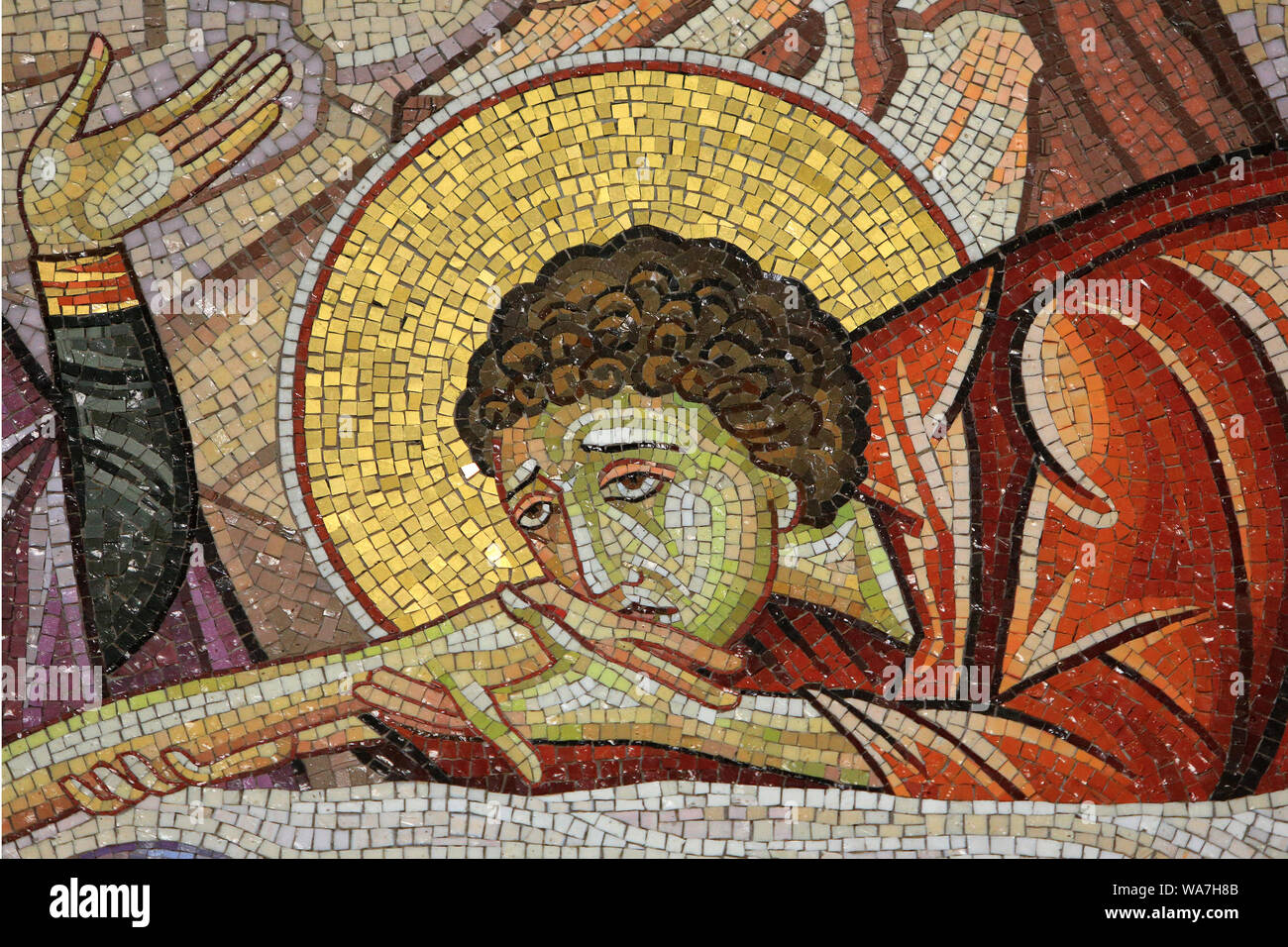 Details. Jesus laid on the new tomb of Joseph of Arimathea. Detail of mosaic art which depicts the burial of Jesus. Holy Sepulchre Church. Jerusalem. Stock Photo