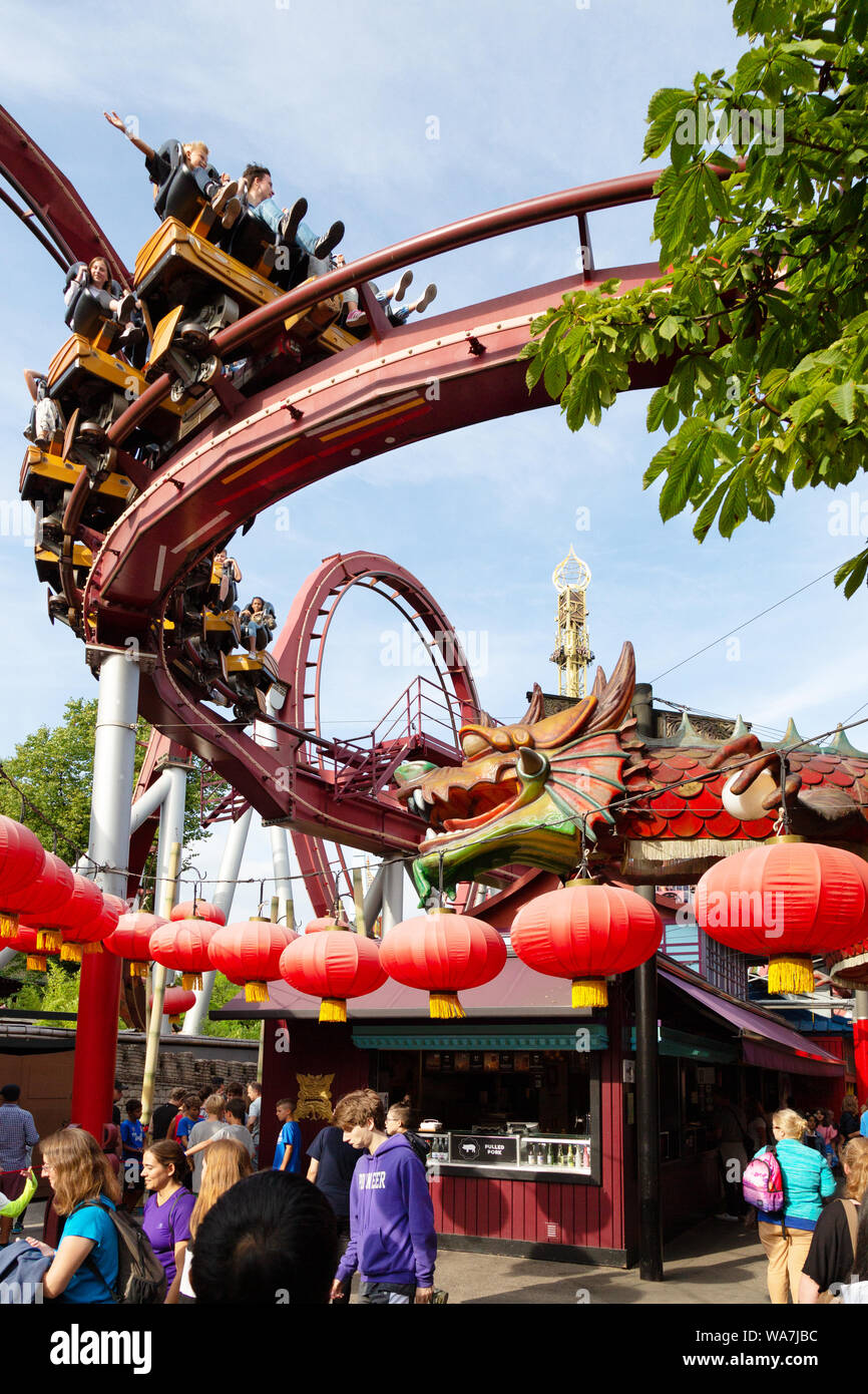 Tivoli Gardens Copenhagen - people enjoying the rollercoaster ride in the amusement park; Tivoli, Copenhagen Denmark Europe Stock Photo