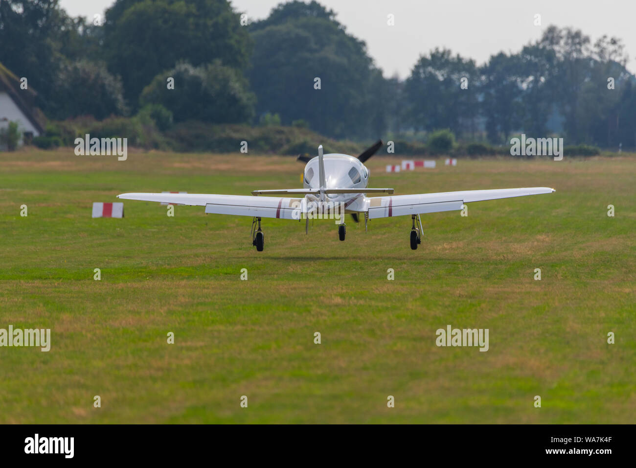 a  landing plane on a small airfield Stock Photo